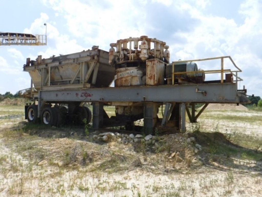 2002 KPI-JCI 1400 LS 54 inch used clone crusher side view.