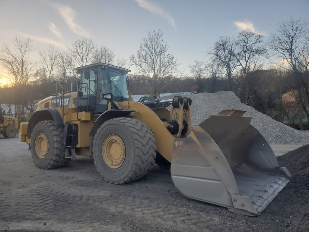 2016 CAT 982M Wheel Loader - Material Handler front side view.